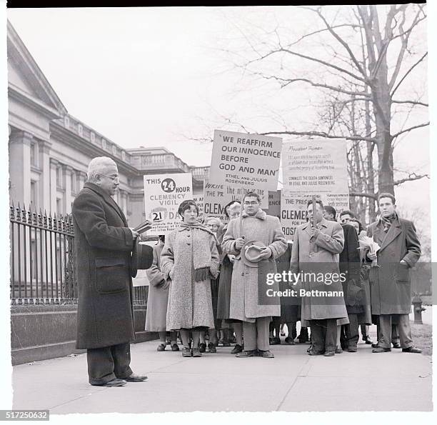 Washington: Rosenberg Pickets End Vigil. Rev. Harold S. Williamson of the church of the Rugged Cross, N. Y., leads a group of pickets in a short...