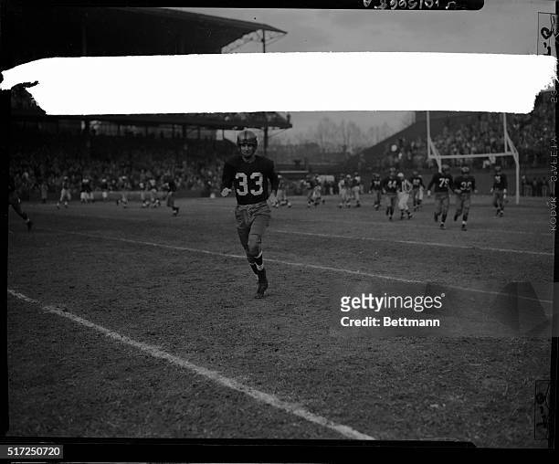 Sammy Baugh, quarterback for the Washington Redskins, leaves the field for the last time as a professional player during the Washington...