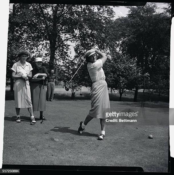 Staging a comeback after one of her operations, Babe Didrikson Zaharias drives from the 13th tee during the opening round of the All-American Golf...