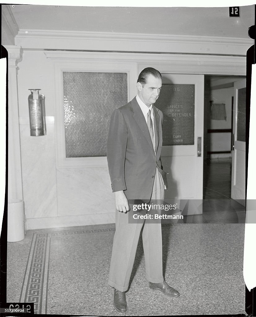 Howard Hughes Standing in Hallway