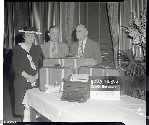 First Lady of the Cabinet Prepares to Leave. Washington, D.C.: Frances Perkins, the first woman member of a presidential cabinet is pictured here as...