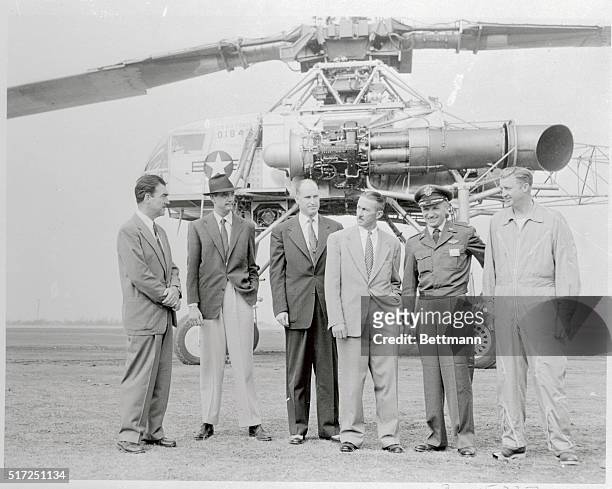 Howard Hughes chats with aides as his XH-17, the world's largest helicopter, made it's first test flight. The XH-17 is an experimental heavy-lift...