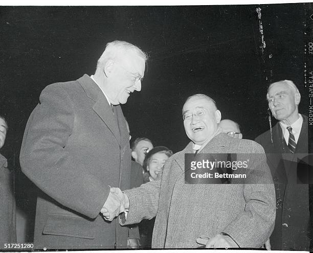 Japanese Prime Minister Shigeru Yoshida is greeted by United States Secretary of State John Foster Dulles after arriving in the U.S. Capital. The...