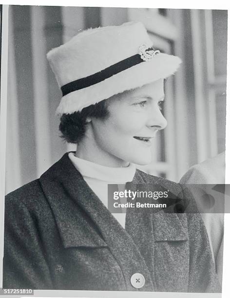 Mrs. Anthony Eden sets the standard for millinery style in a "conservative" vein. She is shown wearing a fur felt fedora in striking white at the...