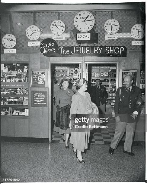 Queen Mother Elizabeth and Mrs. Eisenhower leave jewelry store at Pentagon following sightseeing tour November 16.