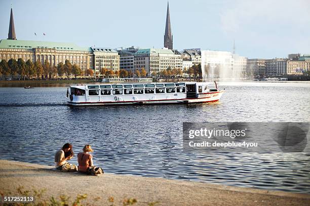 alster lake (binnenalster) hamburg, germany wwith tourist-cruise-boat - alster river stock pictures, royalty-free photos & images