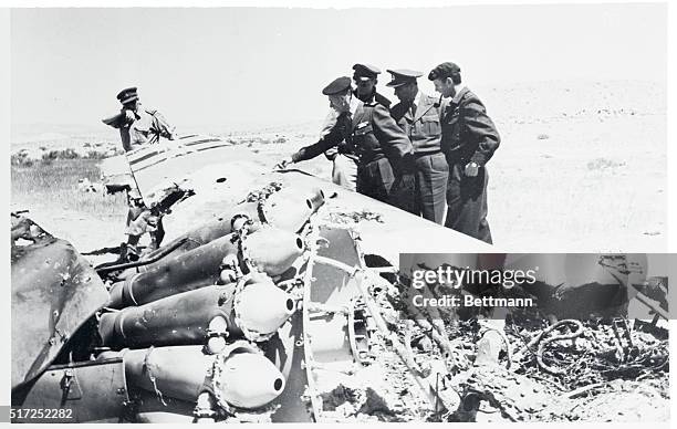 United Nations officials inspect the wreckage of an Egyptian plane brought down in Israeli territory during recent border skirmishes. New violence...