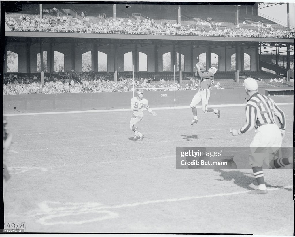 Football Player Intercepting a Pass