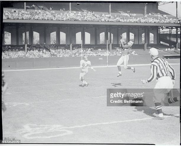 Chicago, Illinois: Chicago Cardinals' halfback Lin Crow intercepts pass intended for Bobby Walston of the Philadelphia Eagles during the 2nd quarter...