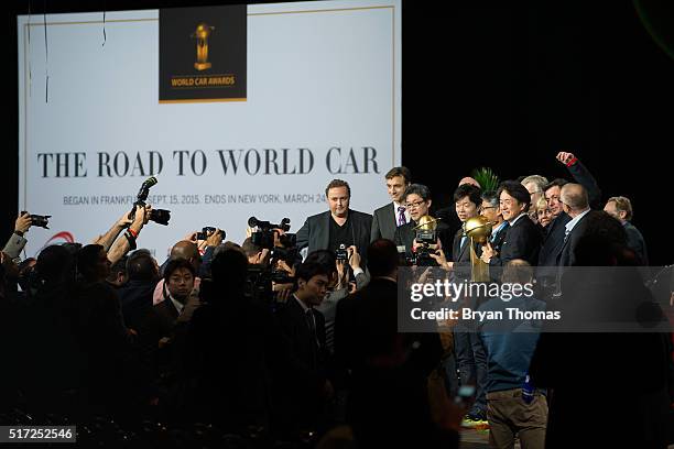 Team of Mazda executives accept the 2016 World Car Award for Car of the Year at the New York International Auto Show at the Javits Center on March...