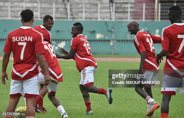 Sudan's national football team players joke during a training session at the Felix Houphouet-Boigny stadium in Abidjan on March 24 on the eve of...
