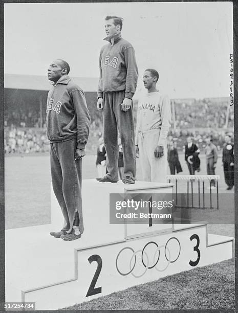 After Patton Redeemed Himself. London, England: Mel Patton, "World's Fastest Human," is shown in the No.1 spot on the victor's rostrum at the...