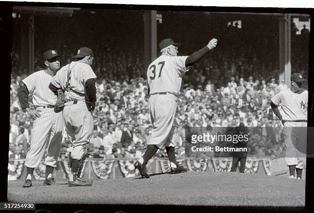 New York Yankees' manager Casey Stengel waves his arms as he walks out to the mound in the 4th inning to take out pitcher Bobby Shantz in the second...