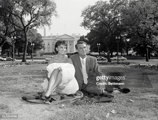 Movie stars Sophia Loren and Cary Grant, here to film a new motion picture, took advantage of Washington's ILD summer weather to feed the pigeons in...