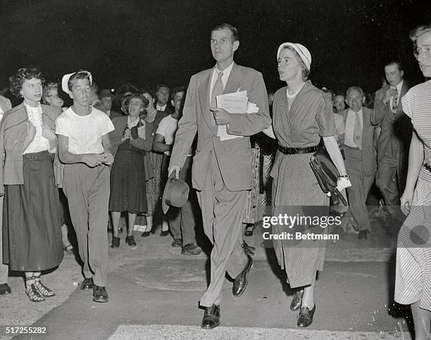 Mr. And Mrs. Alger Hiss, and Carol Buttemweiser, , a family friend, are shown leaving the Federal Court tonight after the jury that heard the...