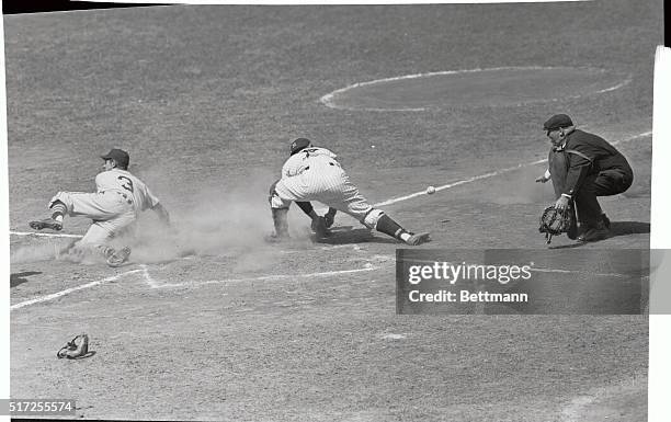 Johnny Groth of the Detroit Tigers is safe and snug at home on Lipon's fly to left field in the second inning of the game against the New York...