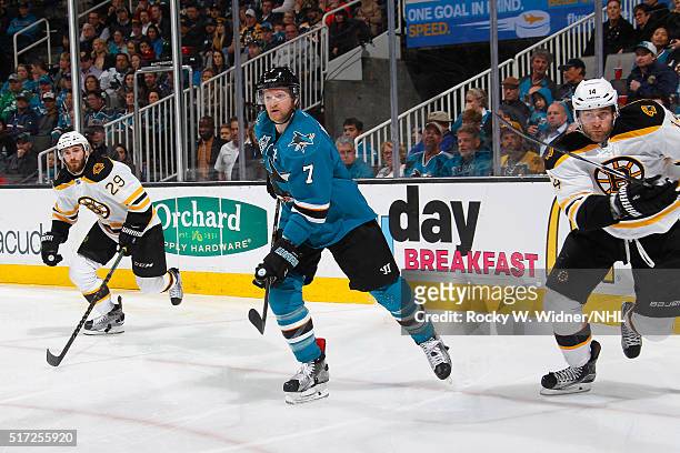 Paul Martin of the San Jose Sharks skates against Landon Ferraro and Brett Connolly of the Boston Bruins at SAP Center on March 15, 2016 in San Jose,...