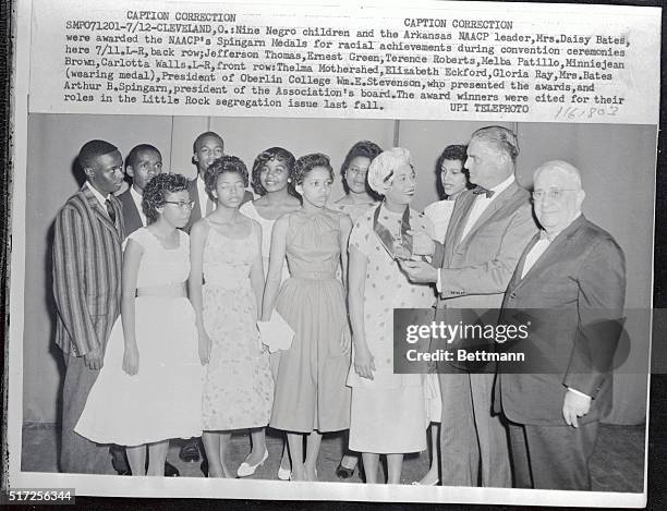 Arkansas NAACP leader Daisy Bates is presented with the Springarn award for Racial Achievment by Oberlain College President William E Stevenson and...