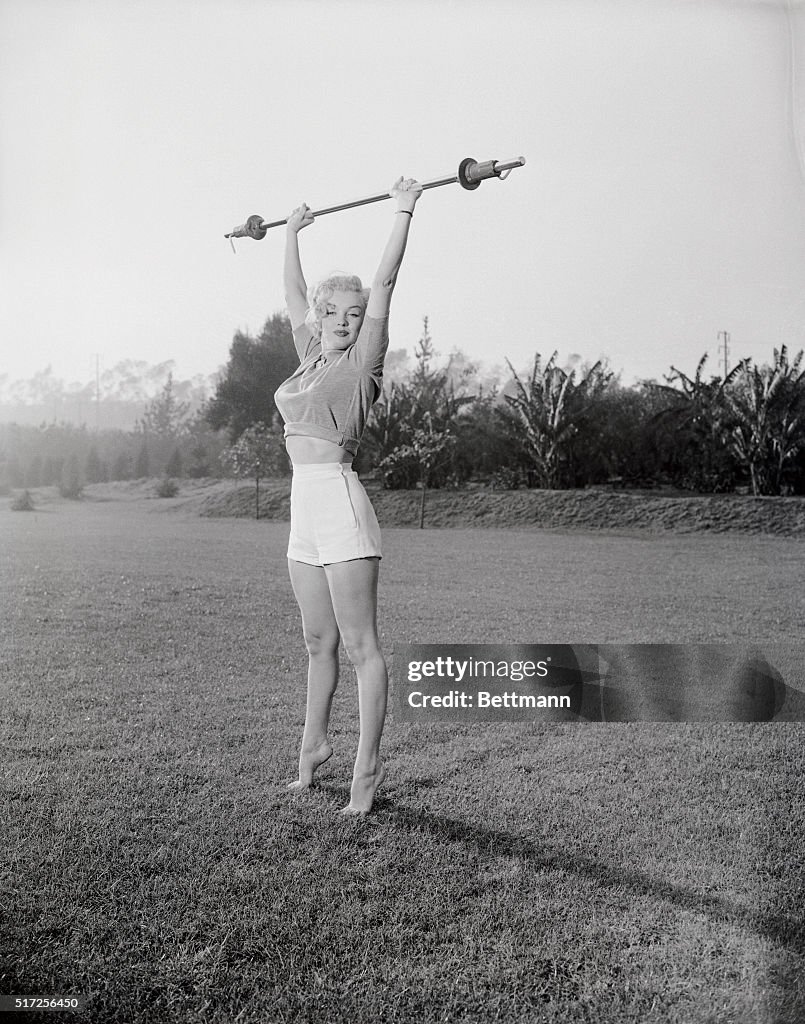 Marilyn Monroe Exercising on Grass