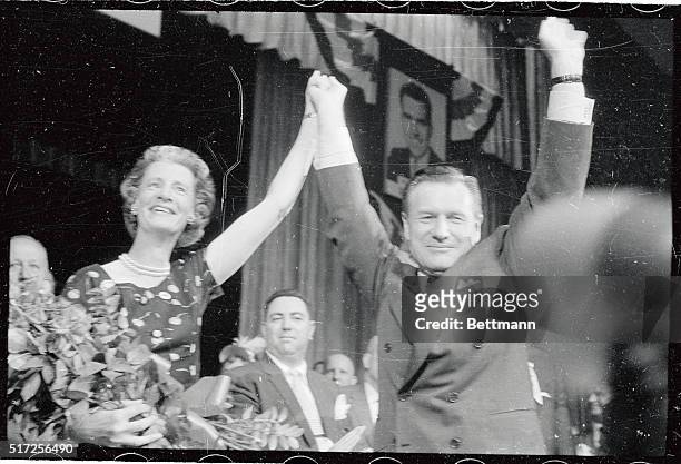 Nelson A. Rockefeller and his wife acknowledge the cheer of the crowd after he accepted the nomination of Governor of New York State at the New York...