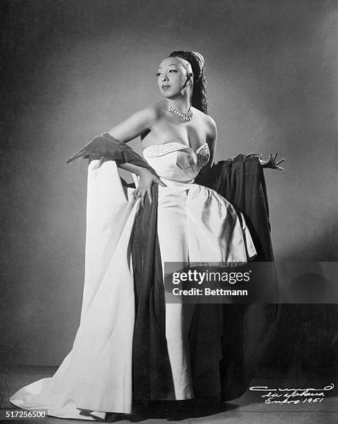 Josephine Baker, wearing one of her gorgeous gowns, part of her $150,000 collection of gowns and furs, returns to Broadway after 15 years. Baker, the...