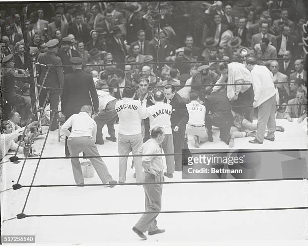 New York: The contrast of victory and defeat shows clearly in this photo, taken at the end of tonight's scheduled ten-round bout between Rocky...