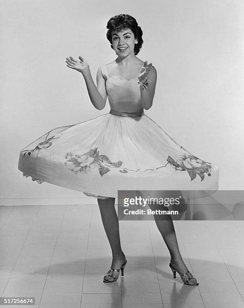 In a whirl, Annette Funicello shows off the beauty that the viewers have seen blossoming on their TV screens for the past four years. Now a sweet 16,...