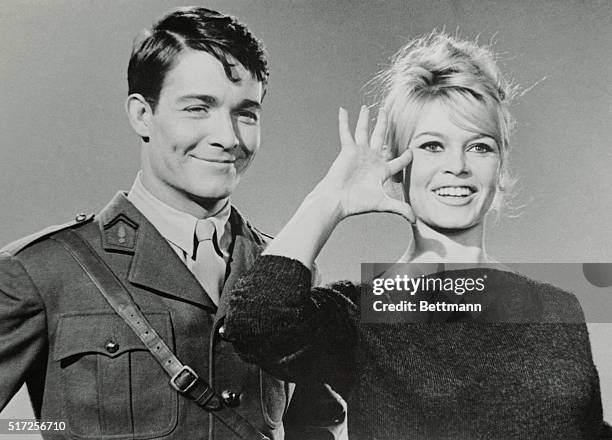 Slated to become a war heroine, on the screen that is, French movie actress Brigitte Bardot previews with a salute her role in the forthcoming film,...