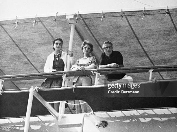 Leaning on the rail of the yacht, Christina, , is opera star Maria Callas, and a woman believed to be Artemis Onassis, sister of Aristotle, along...