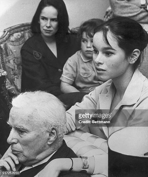 Father and Daughter. Corsier-Sur-Vevey, Switzerland: Leaning affectionately on her father, famed comedian Charles Chaplin, 14-year-old Geraldine...