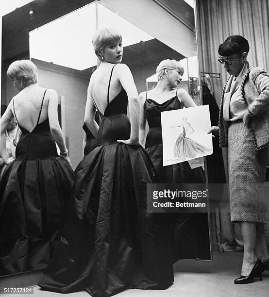 Hollywood, CA- Actress Shirley MacLaine , Academy Award nominee for the Best Actress, for her part in "Some Came Running," models the gown here that...