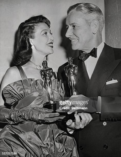 Loretta Young and Ronald Colman pose with the Oscars they received as Best Actor and Actress of 1947. Miss Young received hers for her acting in The...
