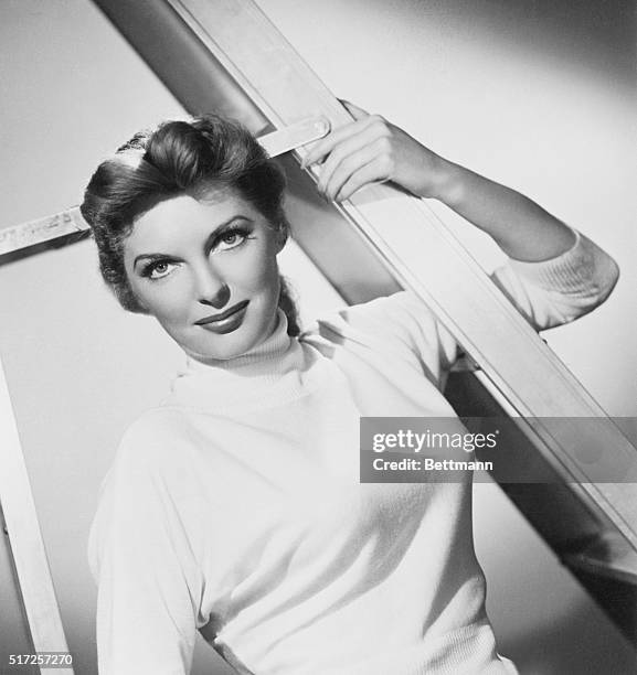 Hollywood: Singer Julie London is dashing around Hollywood in a mad rush trying to find a new dress for an appearance before President Kennedy and...