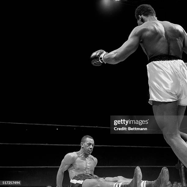 Cassius Clay hovers over Sonny Banks after flooring him in the 4th round. Clay, from Louisville, Kentucky, scored his 11th consecutive professional...