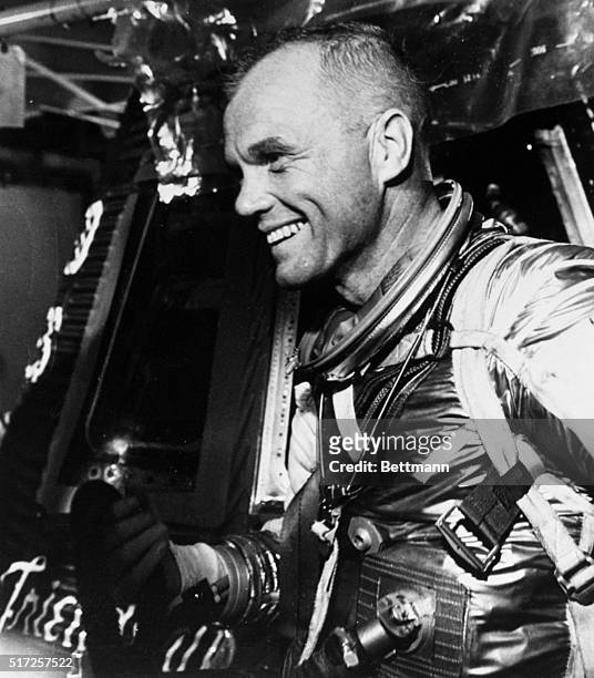 Cape Canaveral, Fla.: Astronaut John H. Glenn, Jr. Shown in recent photo with his Friendship Seven space capsule in the background, got the "Go"...