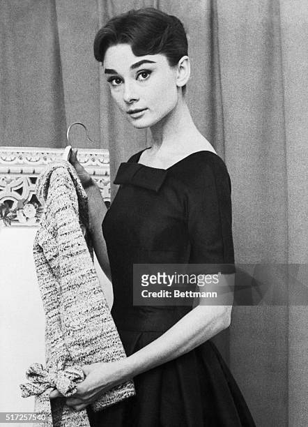 Audrey Hepburn, Hollywood film star, is tied for fifth place with Marlene Dietrich on the 1956 list of the World's Best Dressed Women, made public...