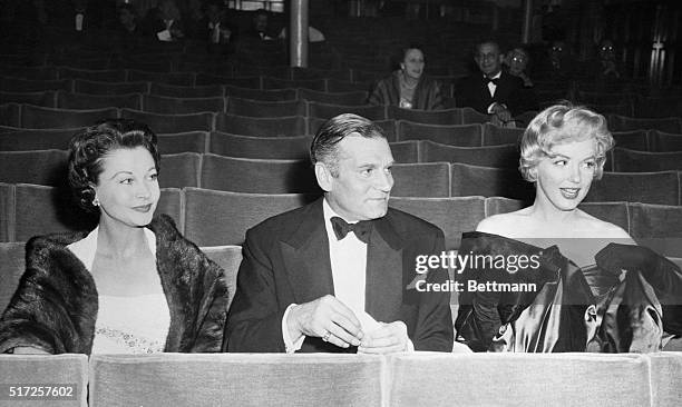 Seated in the stalls of the Comedy Theater for the London premiere of Arthur Miller's play, "A View From the Bridge," are Vivien Leigh, her husband,...