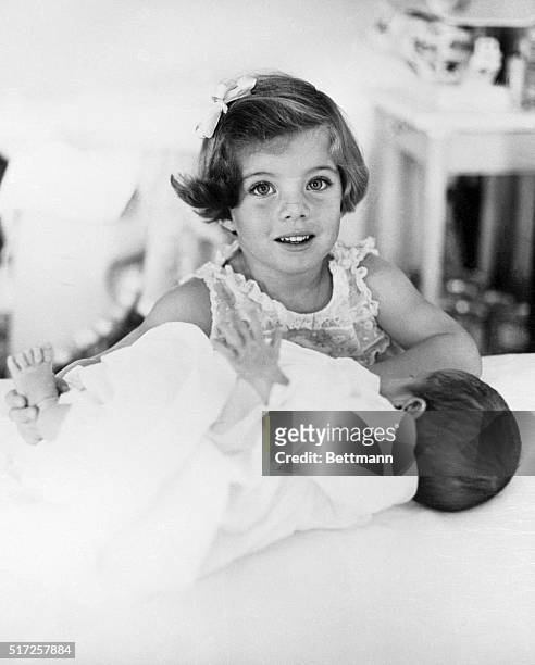 Caroline Kennedy plays with her baby brother, John F. Kennedy Jr. Both are the children of John F. Kennedy and Jacqueline Kennedy.