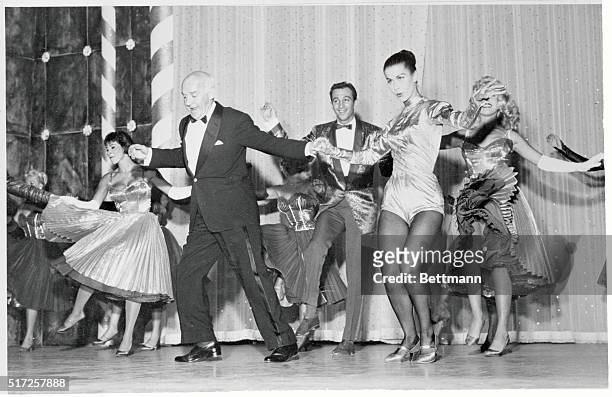 Las Vegas: Winchell Dances. Columnist Walter Winchell, once a vaudeville hoofer, does a mambo with dancer Lita Leon during his opening night...