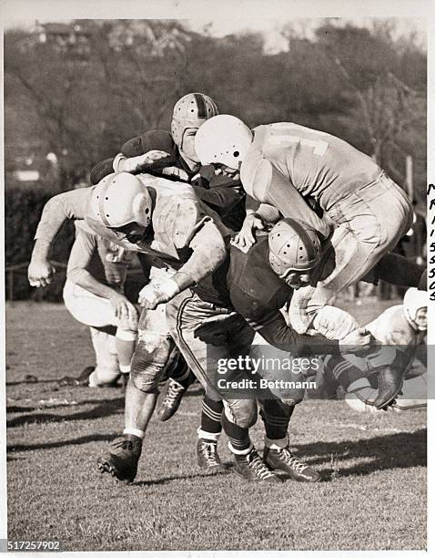 New York, NY- Vern Wynott of Columbia takes to the air to go over left tackle for a nine-yard gain in the second quarter of the game against the Navy...