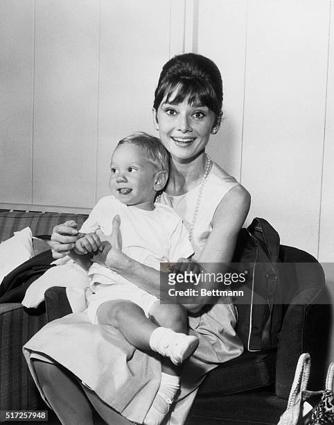 One of Hollywood's brightest stars, Audrey Hepburn has a joyful reunion with her son Sean, three years old, upon his arrival from Los Angeles via TWA...