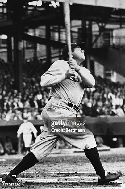 Date filed 8/6/1961-New York, NY- Full length shot shows Babe Ruth about to hit a baseball, looking up.