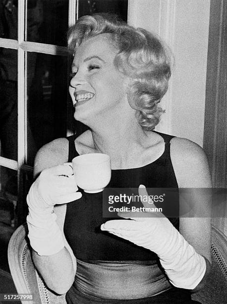 Actress Marilyn Monroe, bride of playwright Arthur Miller, is shown as she posed during a press conference in London shortly after her arrival in...