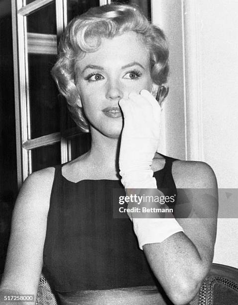 Actress Marilyn Monroe, bride of playwright Arthur Miller, is shown as she posed during a press conference in London shortly after her arrival in...