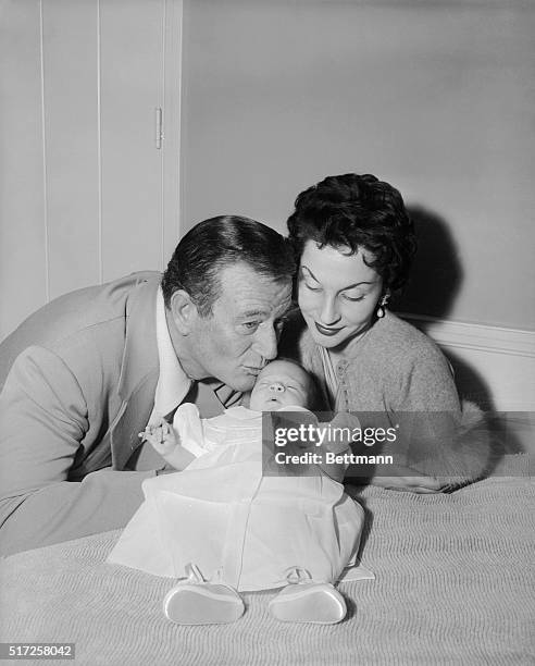 Encino, California: Here is the first formal picture of Aissa Wayne, 20 day old daughter of John Wayne and his wife, Pilar Pallette. The little one...