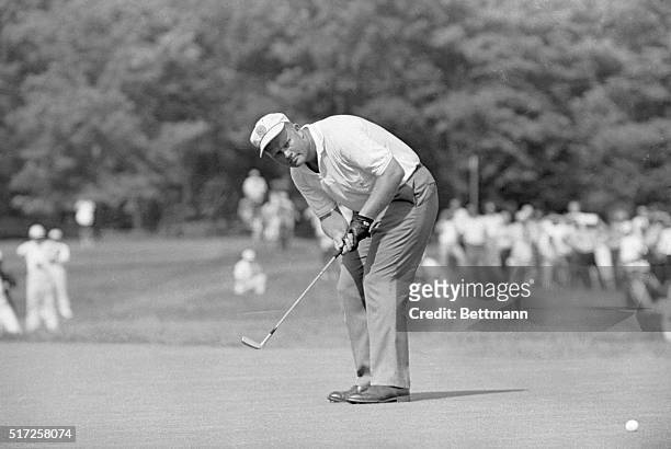 Jack Nicklaus putting on the 13th green during playoff match against Arnold Palmer for the US Open Golf title.