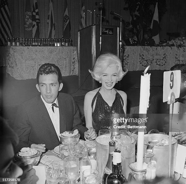 Marilyn Monroe at the Golden Globes Awards with screenwriter Jose Bolanos.