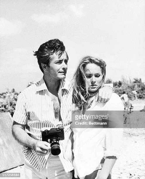 Ursula Andress' husband, actor John Derek is the most important visitor to the Jamaica location site as far as she's concerned. The tripod behind...