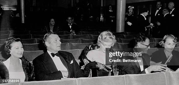 Sir Laurence Olivier and Lady Olivier accompanied Marilyn Monroe and her husband, Arthur Miller, to the Comedy Theater, London, tonight for the first...
