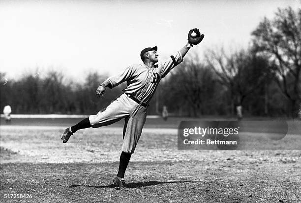 Ty Cobb, outfielder with the Detroit Tigers, seen making a fielding play during spring training.